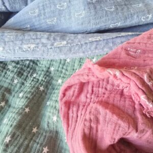 Tessuti in mussola di cotone dai colori pastello, ideali per corredini, accessori e cucito creativo per neonati