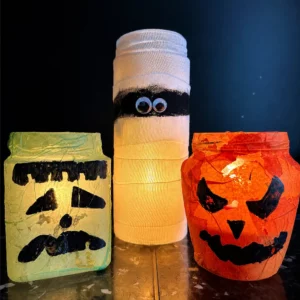 Lanterne di Halloween illuminate con barattoli riciclati Frankenstein mummia e zucca