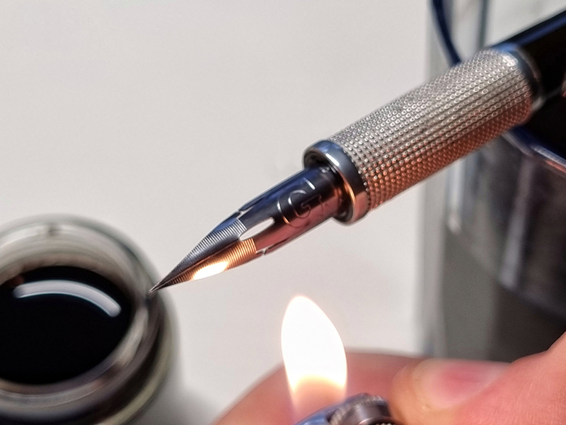 pennino nuovo per scrittura con fiamma accendino